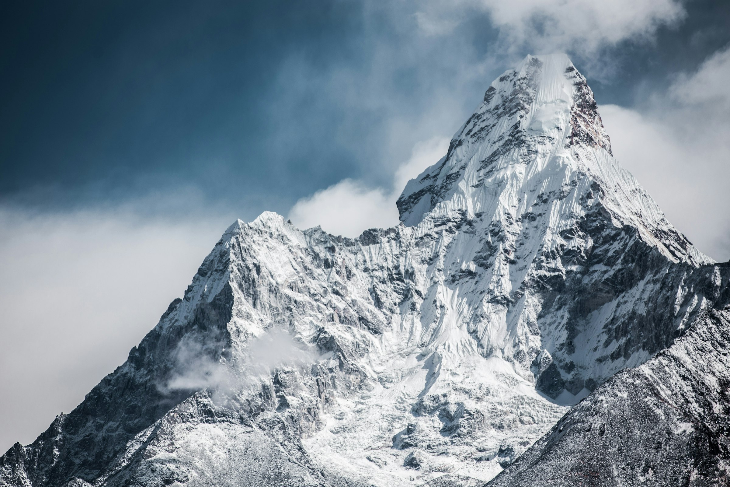 Snow-capped Himalayan peaks of Nepal under a dark sky